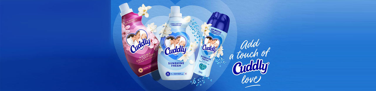 Cuddly fabric softener and scent booster bottles with white flowers on blue, ‘Add a touch of Cuddly love
