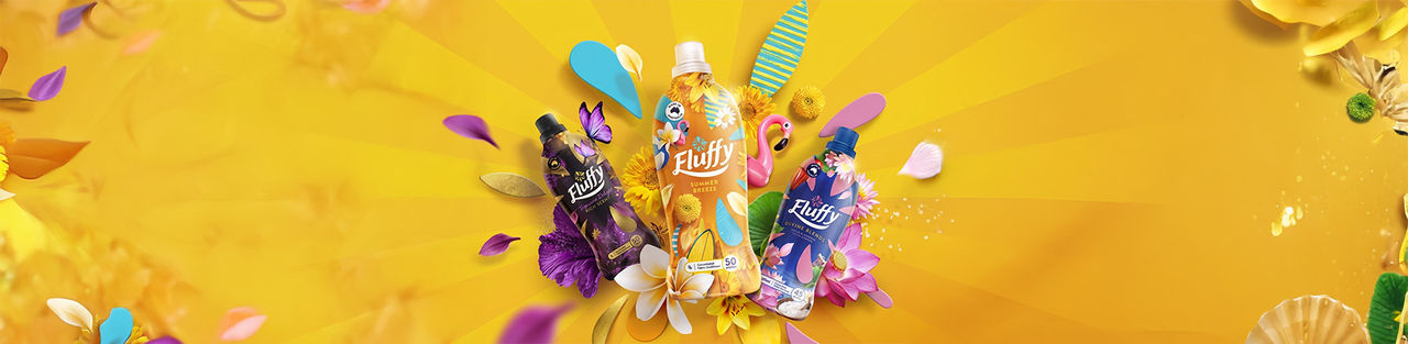 Fluffy fabric conditioner range including Summer Breeze, Divine Blends, and Tropique Delight bottles with tropical floral graphics.